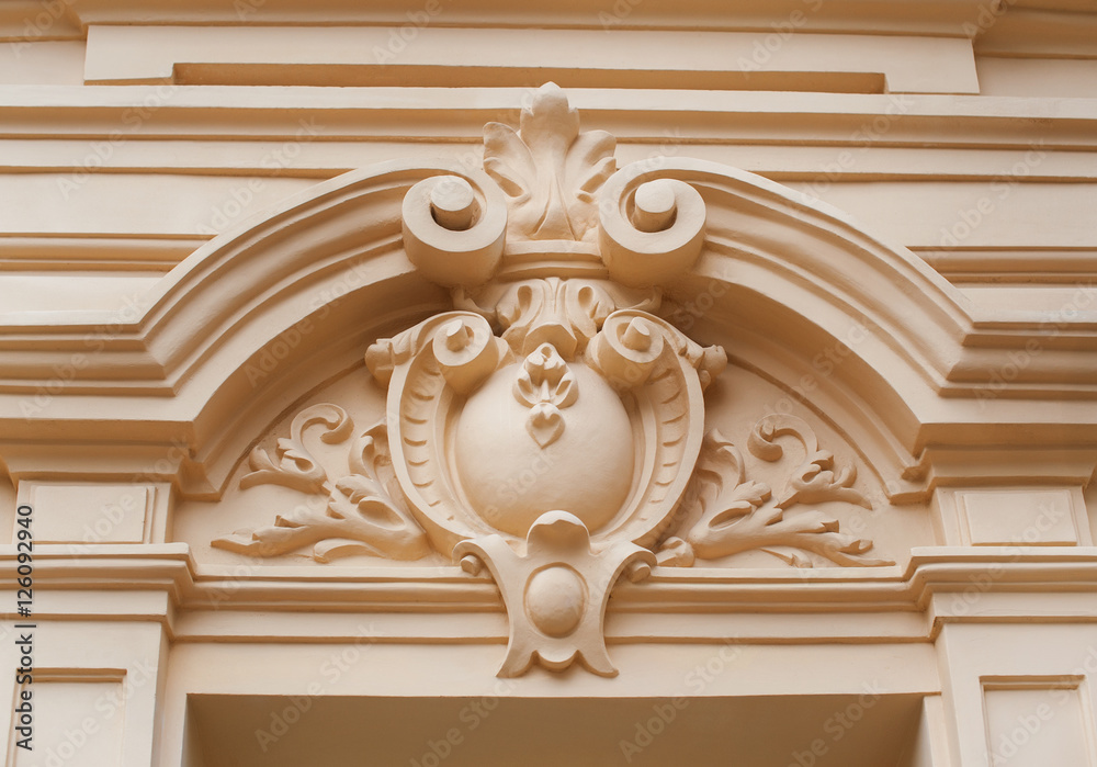 architectural molding on the wall outside the building