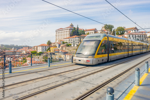 Porto Oporto metro subway tram train railway bridge Douro river rail public transport empty street sunny day