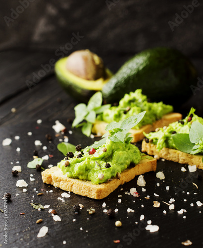 toast with a paste of avocado and pesto basil, spices