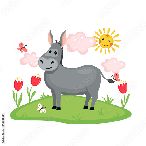 Cute donkey on a meadow with flowers.