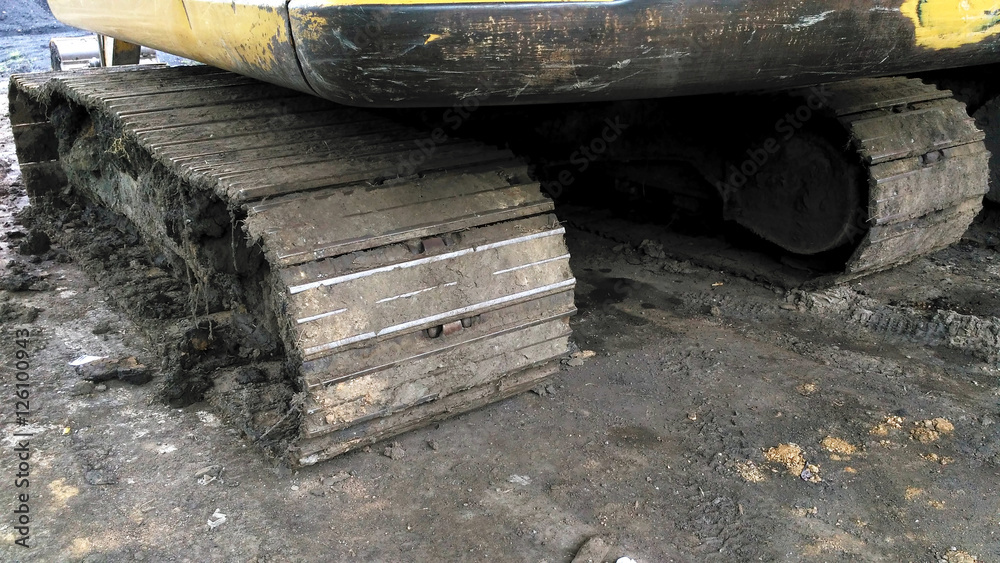 looked dirty excavator chains from side behind