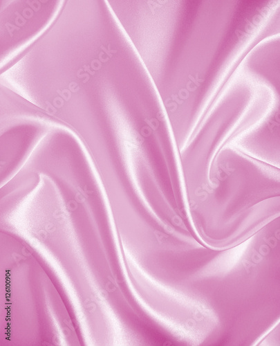 Smooth elegant pink silk or satin texture as background