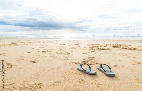 sandals on the sandy sea coast