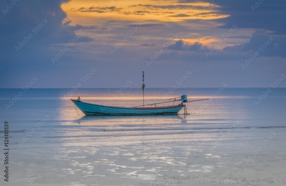 Naklejka premium Fishing boats in the sea and a beautiful sky while the sunset, Chao Lao Beach, Chanthaburi, Thailand.