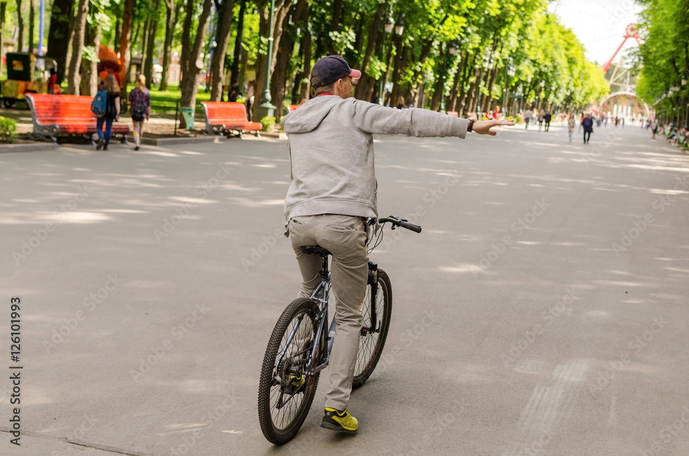 Fototapeta premium Young man with bicycle