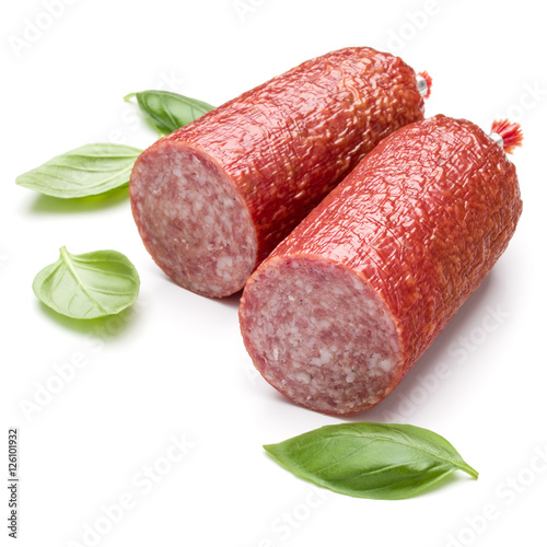 Salami smoked sausage and basil leaves isolated on white backgro