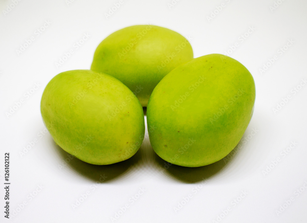Green tomatoes on white background. Bunch of vegetables for salad or soup. Green tomatoes on white background. Bunch of vegetables for salad or soup.