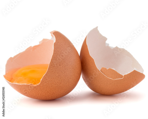 Broken egg  in eggshell half isolated on white background cutout