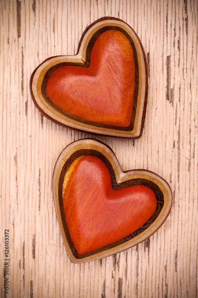 Two wooden hearts on rustic wood background. Valentines days con Two wooden hearts on rustic wood background. Valentines days con