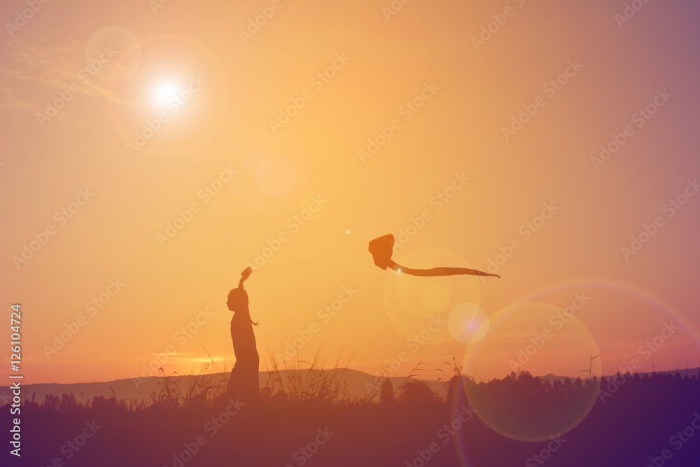 Silhouette of children playing kite on field in harvest season,Happy farmer at sky sunrise in the morning