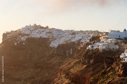 Panorama of Firostefani town on Santorini island, Greece at suns