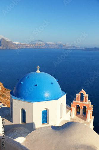 Red belled church in Oia, Santorini at daylight.
