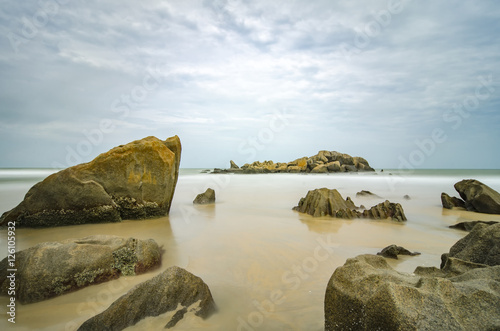 Stunning sea view of tropical beach. Wet Rock and crystal clear photo