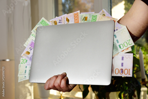 Swedfish money and laptop