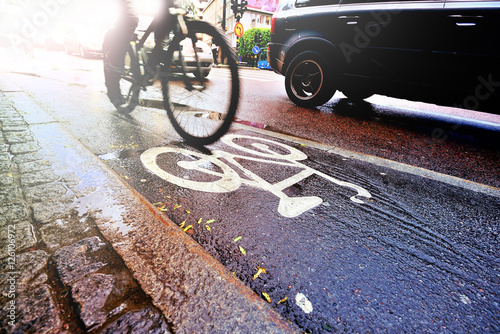 Photography Bike lane in rain and traffic