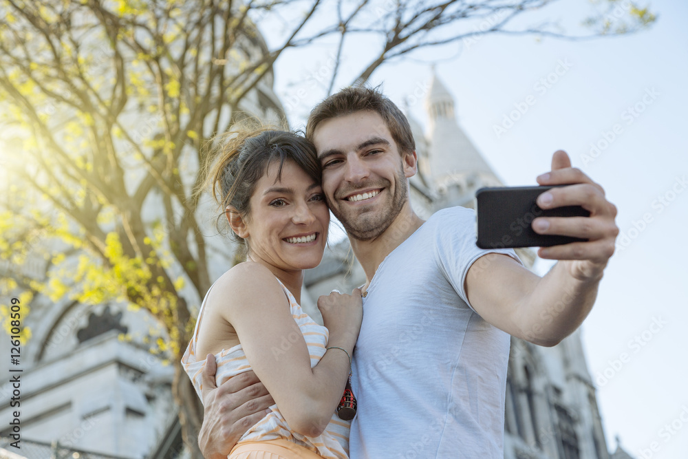 Young couple doing selfie at Montmartre Young couple doing selfie at Montmartre