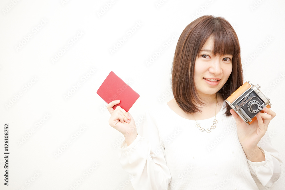 Young woman holding her passport with smile Young woman holding her passport with smile