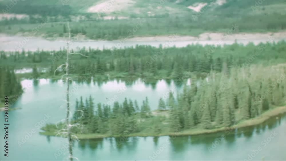 Home Movie 104: Retro 8mm home movie of a lake and mountain.
