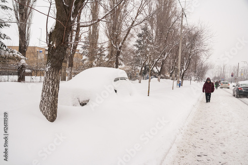 People walking in the street during heavy winter