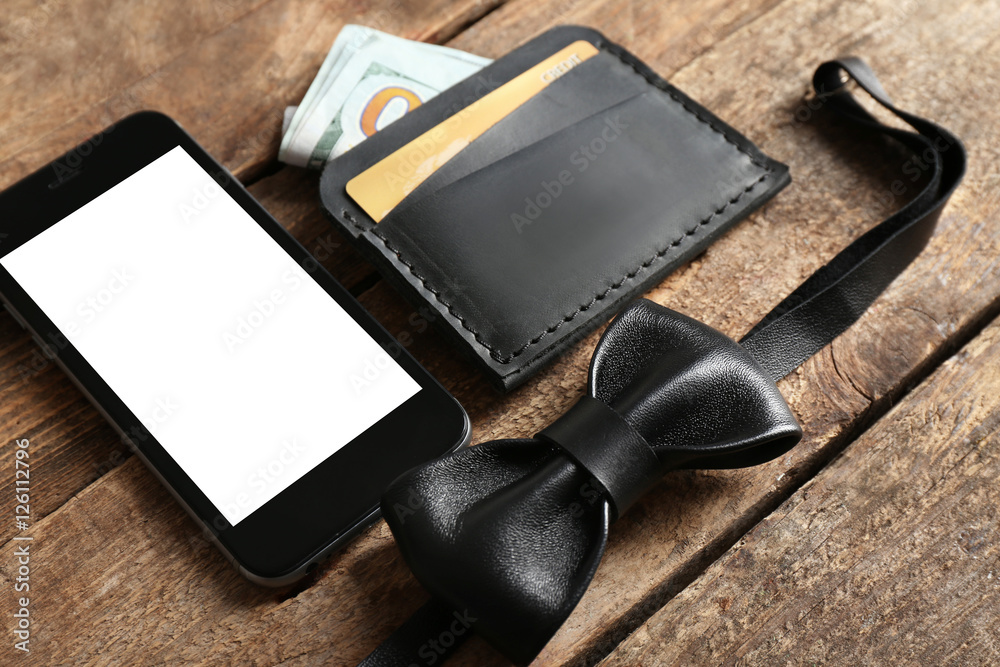 Leather wallet and other man accessories on wooden background Leather wallet and other man accessories on wooden background