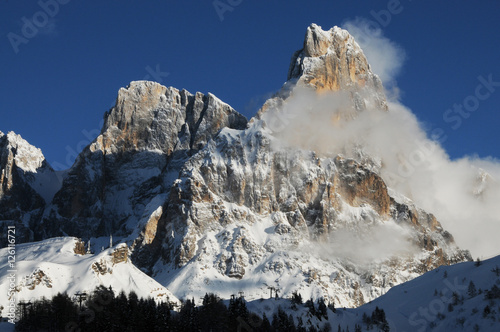 Dolomites Alps, South Tyrol, Italy. Cimon della Pala or Cimone with clouds in the Pale di San Martino Group.