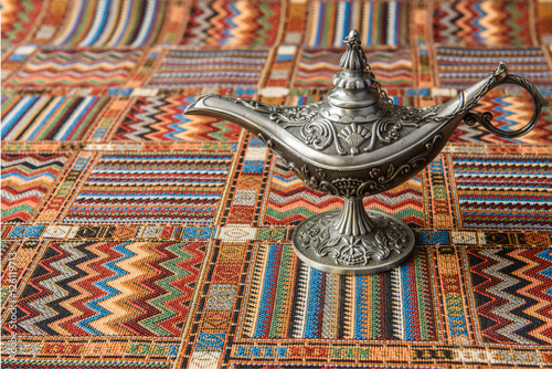 An oil lamp on a traditional Arabic carpet
 photo