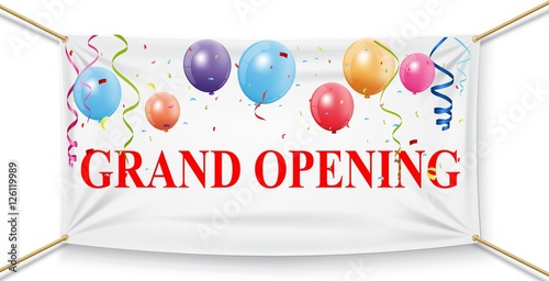 Grand opening banner with confetti and fireworks