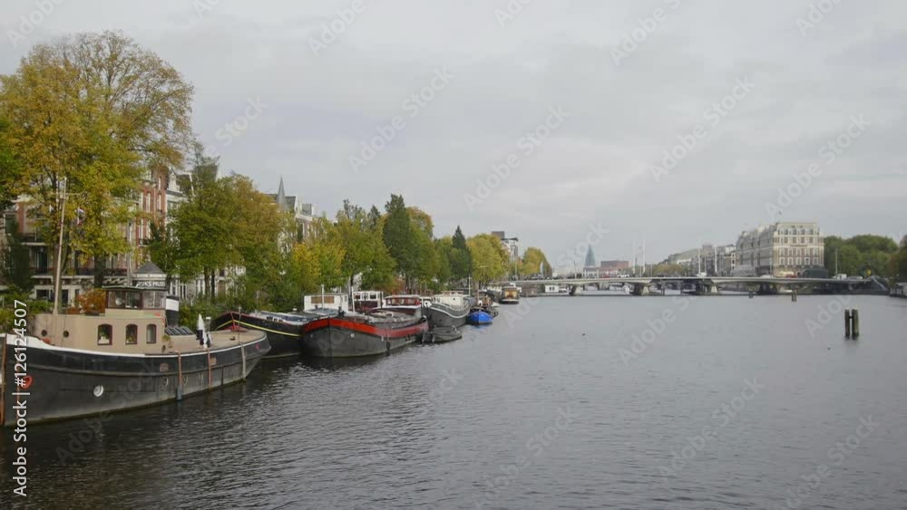 House boat on canal in Amsterdam, Amstel, Holland, Netherlands House boat on canal in Amsterdam, Amstel, Holland, Netherlands