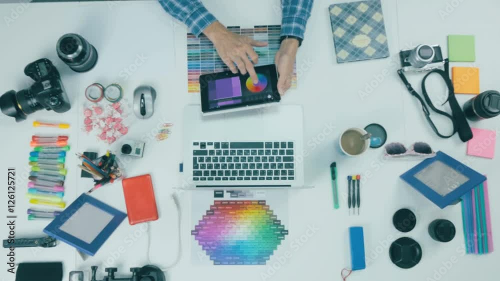 Creative professional graphic designer desk. Above view. 4K Creative professional graphic designer desk. Above view. 4K