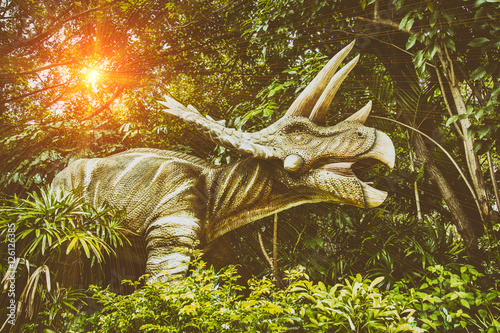 Fototapeta Naklejka Na Ścianę i Meble -  dinosaur toy in the forest in thailand