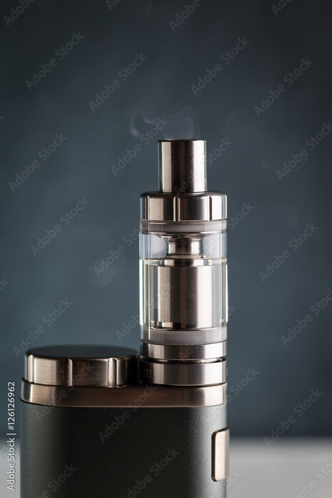 electronic cigarette, vape with a smoke on a black background electronic cigarette, vape with a smoke on a black background