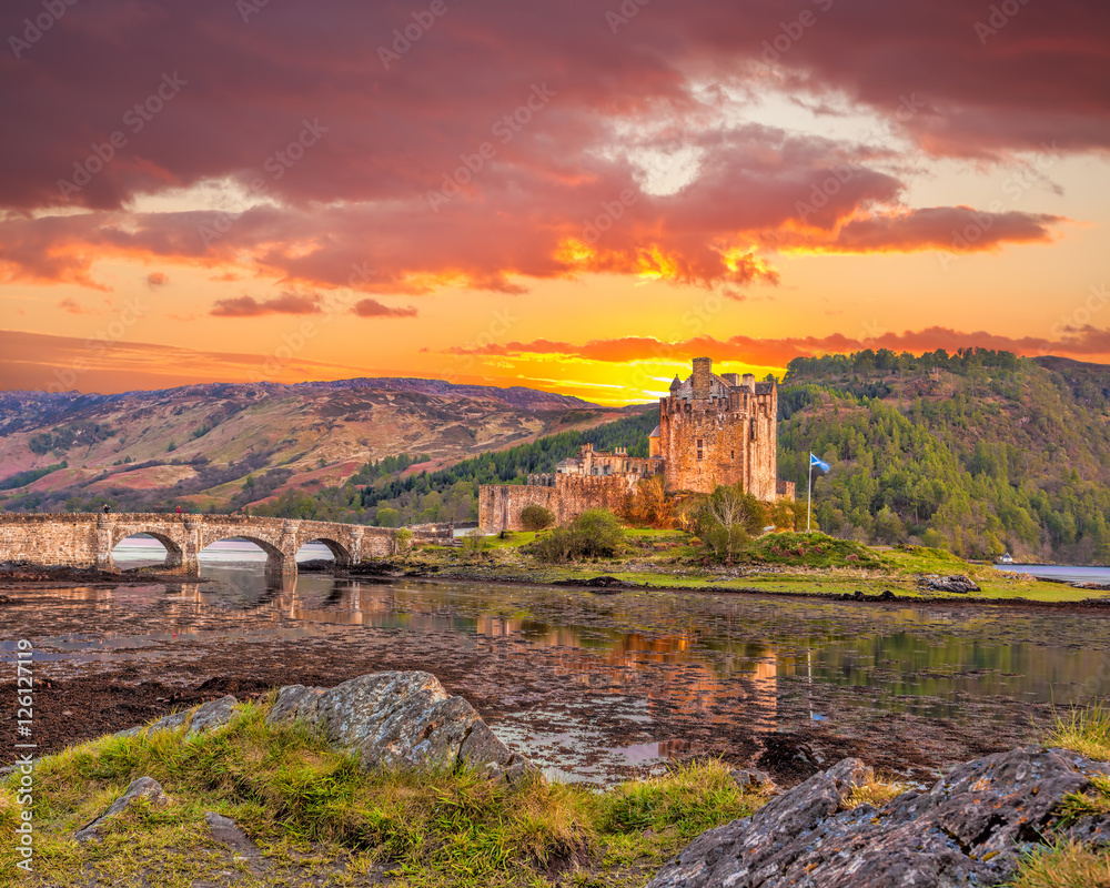 Eilean Donan Castle against sunset in Highlands of Scotland