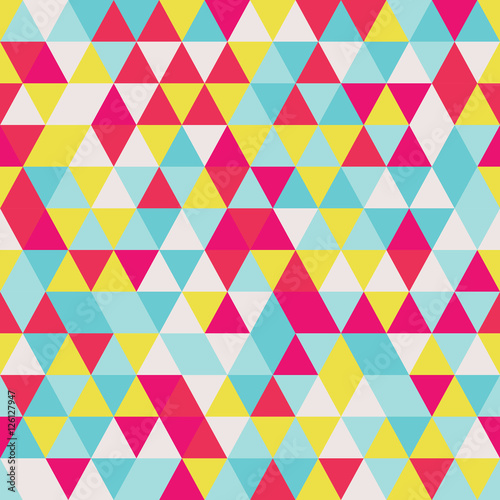 Geometric seamless pattern with colorful triangles in retro design