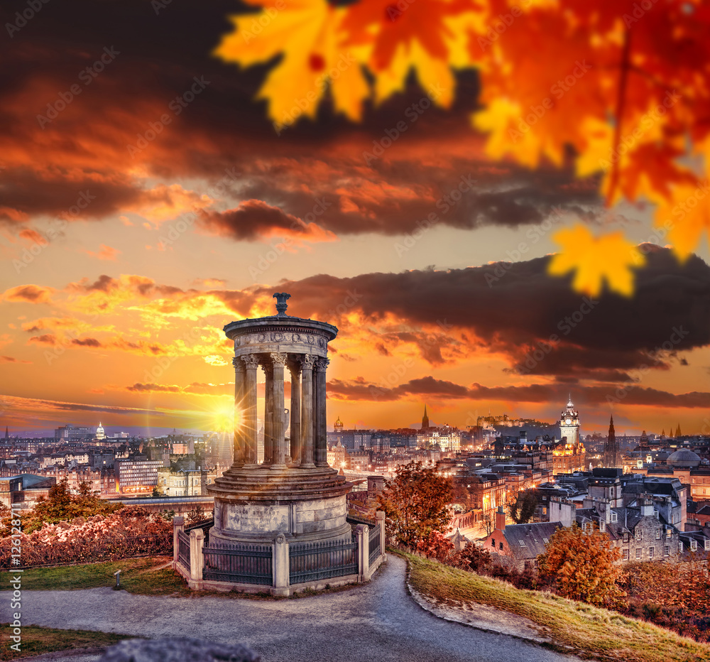 Edinburgh with Calton Hill against autumn leaves in Scotland