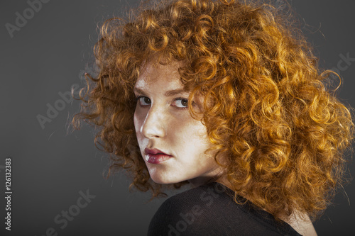 redhead sexy curly young woman
