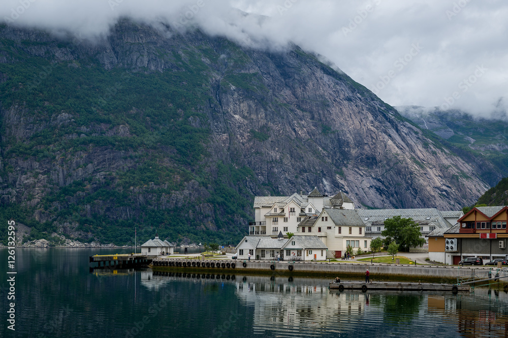 Norwegian fjord town and mountain a background. Norway.