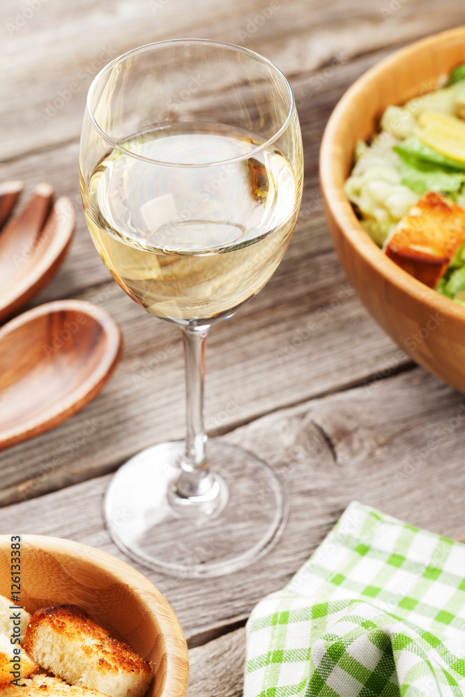 Fresh salad and white wine Fresh salad and white wine