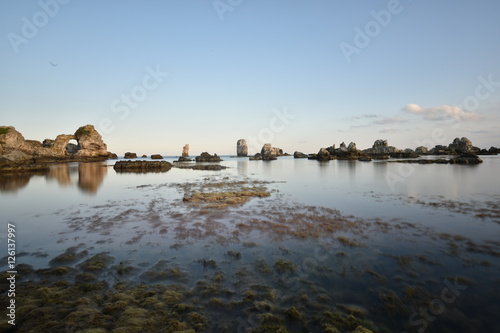 beautiful rocks forms on the sea at sunset time with blue sky on sunset time