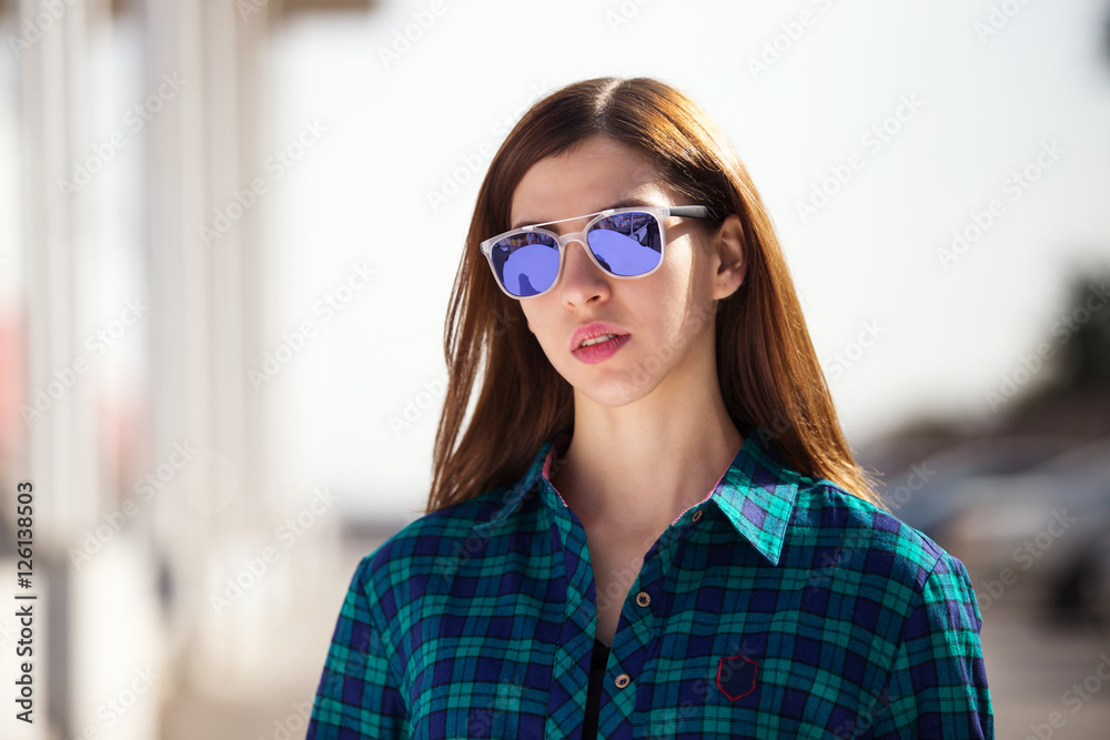 Urban fashionable girl posing outdoors in the city