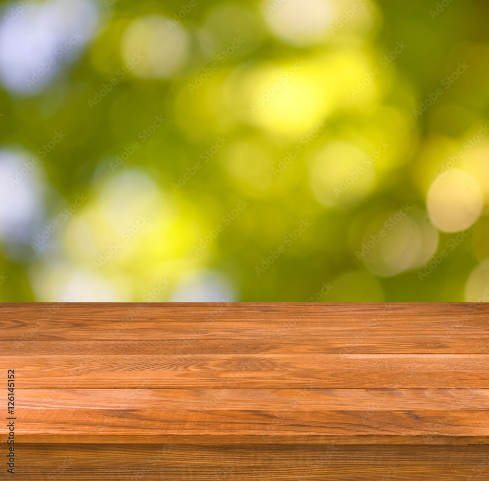 wooden table on green background wooden table on green background