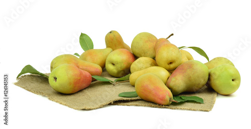 Healthy organic pears scattered on the sackcloth . / isolated/