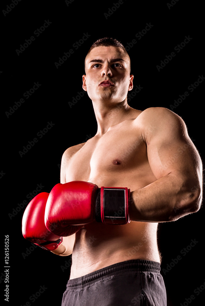 boxer man with red boxing gloves isolated on black background boxer man with red boxing gloves isolated on black background