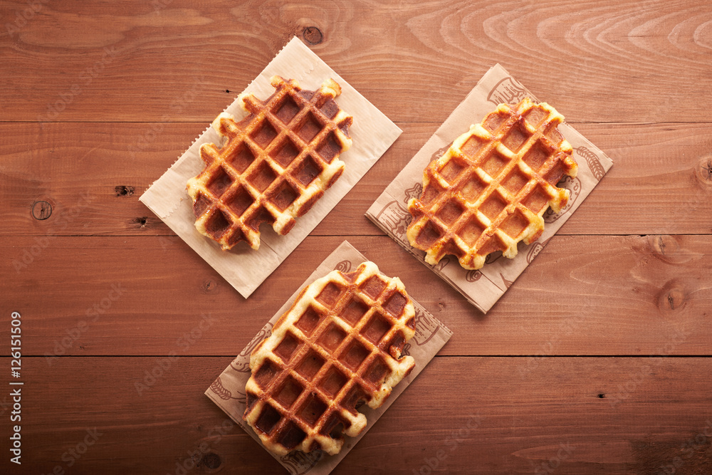 Belgian waffles on a wooden table Belgian waffles on a wooden table