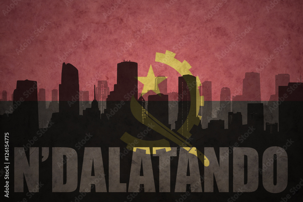 abstract silhouette of the city with text N'dalatando at the vintage angolan flag