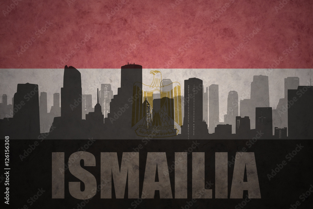 abstract silhouette of the city with text Ismailia at the vintage egyptian flag