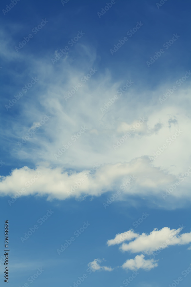 Blue sky cloudy weather. Summertime tranquil cloudscape. Different size white clouds.