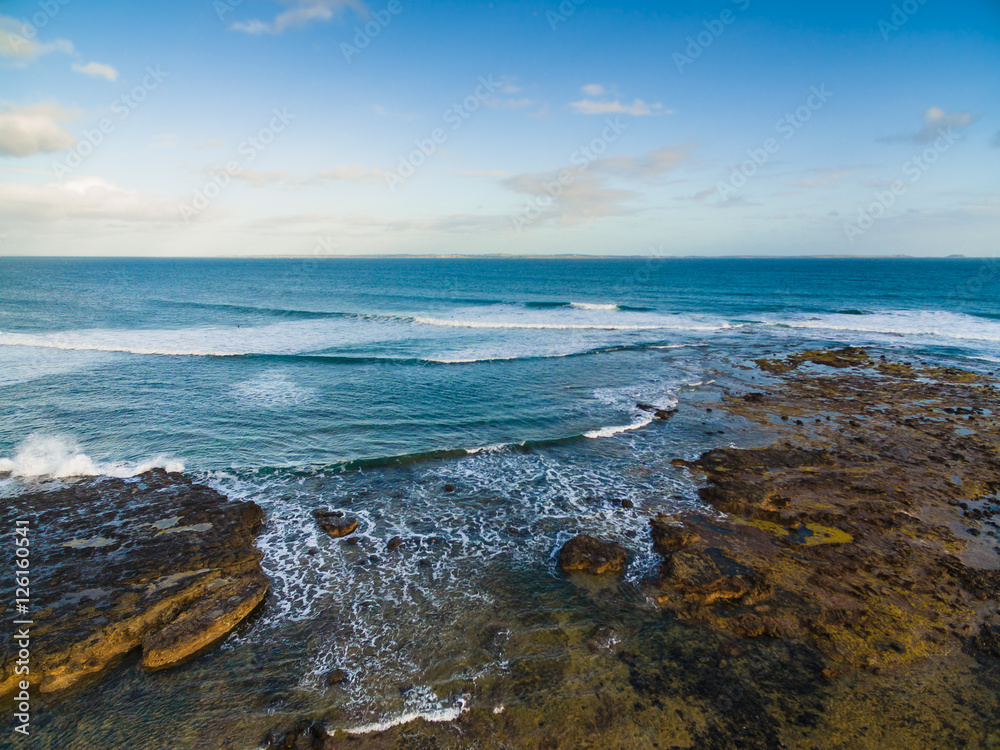 Waves crashing at surf beach point leo