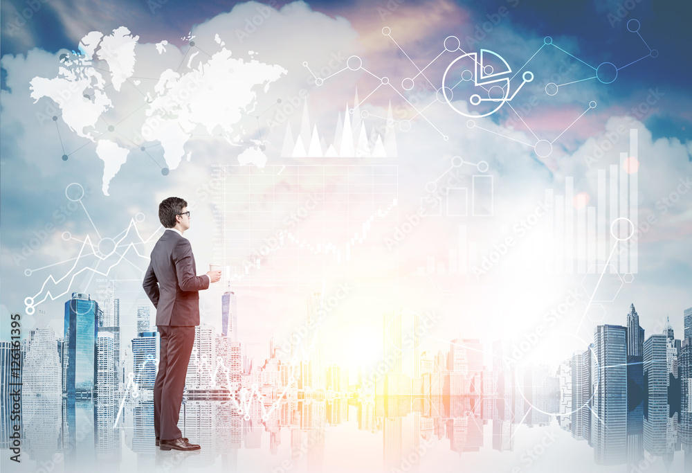 Businessman looking at city with graphs, toned Businessman looking at city with graphs, toned