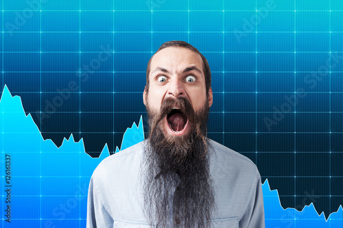 Shouting man near wall with graphs