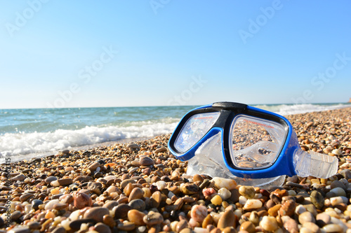 mask for diving on the ocean on a sunny day